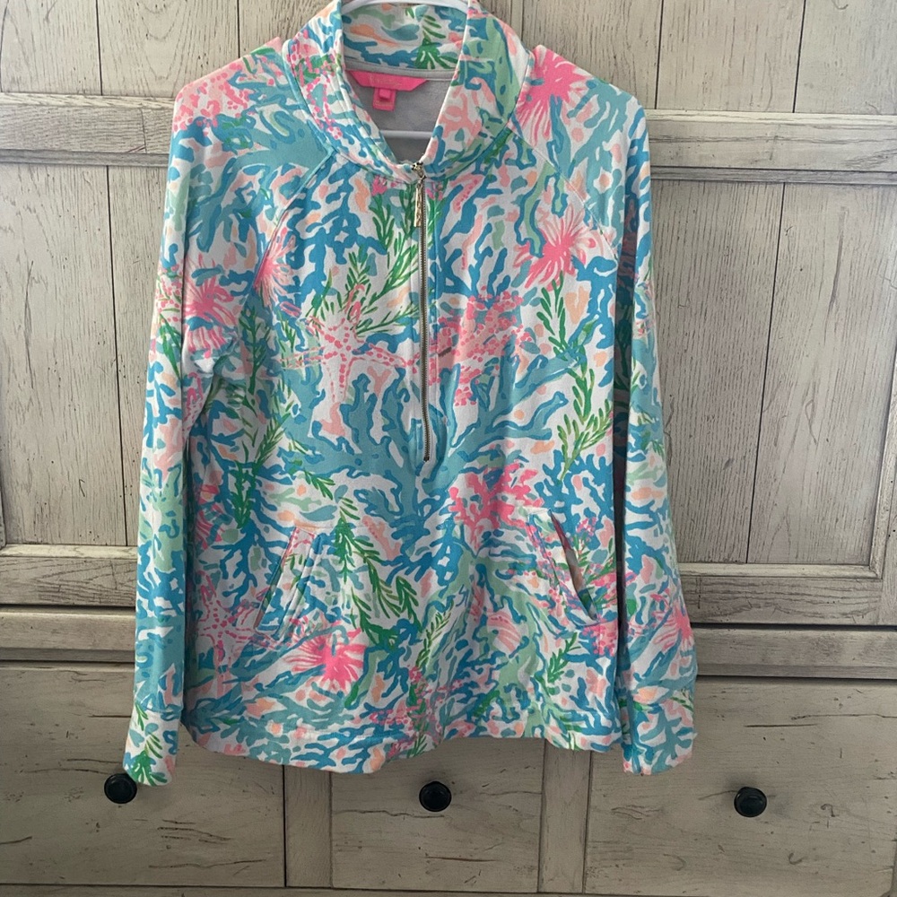 Gorgeous colors on this Lilly half zip with from pocket. Comfy Terry material.